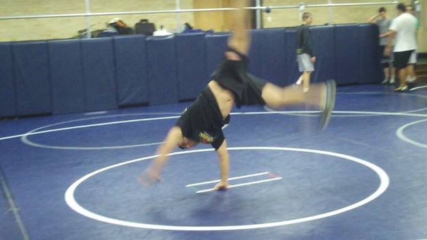 C:\Users\John\Desktop\Hewlett Wrestling Strength\pics\Wrestling Training Tips How to Improve you balance with gymnastics cartwheel series Frame - 57.jpg